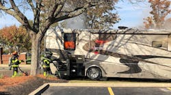 Early in the response to a motor home fire, the crew of Mason, OH, Fire Department Tower 52 applied water to the engine compartment at the rear of the vehicle. There wasn’t much change in the smoke condition at that location as a result, so a rear window was taken out for ventilation. Early in the response to a motor home fire, the crew of Mason, OH, Fire Department Tower 52 applied water to the engine compartment at the rear of the vehicle. There wasn’t much change in the smoke condition at that location as a result, so a rear window was taken out for ventilation.