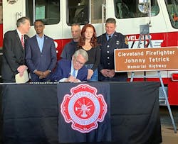 Ohio Gov. Mike DeWine, center, signs House Bill 107, which names a portion of the Interstate 90 after firefighter Johnny Tetrick. DeWine is joined by bill sponsor Rep. Tom Patton, left, Cleveland Mayor Justin Bibb, city fire officials and Tetrick's daughter, Regan. Ohio Gov. Mike DeWine, center, signs House Bill 107, which names a portion of the Interstate 90 after firefighter Johnny Tetrick. DeWine is joined by bill sponsor Rep. Tom Patton, left, Cleveland Mayor Justin Bibb, city fire officials and Tetrick's daughter, Regan.