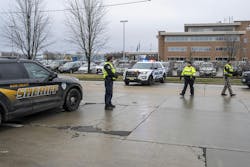 Law enforcement officials near a health care clinic where students from Abundant Life Christian School in Madison, WI, will be reunited withe their parents after a school shooting on Dec. 16, 2024, Law enforcement officials near a health care clinic where students from Abundant Life Christian School in Madison, WI, will be reunited withe their parents after a school shooting on Dec. 16, 2024,
