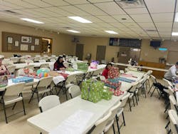 Pittsville, MD, Volunteer Fire Department prepping for their Christmas tradition by wrapping gifts for the sponsored families. Pittsville, MD, Volunteer Fire Department prepping for their Christmas tradition by wrapping gifts for the sponsored families.
