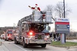 Madison, WI, Fire Department and Fire Fighters Local 311 team up to deliver Santa on a fire engine to the American Family Children's Hospital. Madison, WI, Fire Department and Fire Fighters Local 311 team up to deliver Santa on a fire engine to the American Family Children's Hospital.