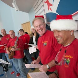 In the American Family Children's Hospital, Madison, WI, Fire Department and Fire Fighters Local 311 join to sing Christmas carols as Santa arrives. In the American Family Children's Hospital, Madison, WI, Fire Department and Fire Fighters Local 311 join to sing Christmas carols as Santa arrives.