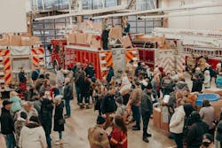 Families gather at the Charlotte, MI, Fire Department to receive gifts as a part of their Christmas Kiddies tradition that dates back to 1906. Families gather at the Charlotte, MI, Fire Department to receive gifts as a part of their Christmas Kiddies tradition that dates back to 1906.