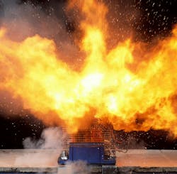 Figure 1. A 10-cell lithium nickel cobalt aluminum oxide (NCA) 18650 cell battery pack during its peak heat release rate (HRR). Figure 1. A 10-cell lithium nickel cobalt aluminum oxide (NCA) 18650 cell battery pack during its peak heat release rate (HRR).