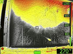 The view from a thermal imager of a Bresnan nozzle operating in a compartment fire. The view from a thermal imager of a Bresnan nozzle operating in a compartment fire.