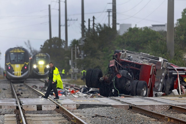 Four members of Delray Beach Fire Rescue, including a captain, engineer and two chiefs, were placed on leave following a collision between a ladder truck and train.