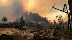 At least 10 people have died and 9,000 structures have been destroyed by the multiple wildfires fanned by powerful winds.