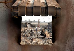 William Harris looks over the damage to a home ravaged by the Eaton Fire in Altadena on Thursday. William Harris looks over the damage to a home ravaged by the Eaton Fire in Altadena on Thursday.