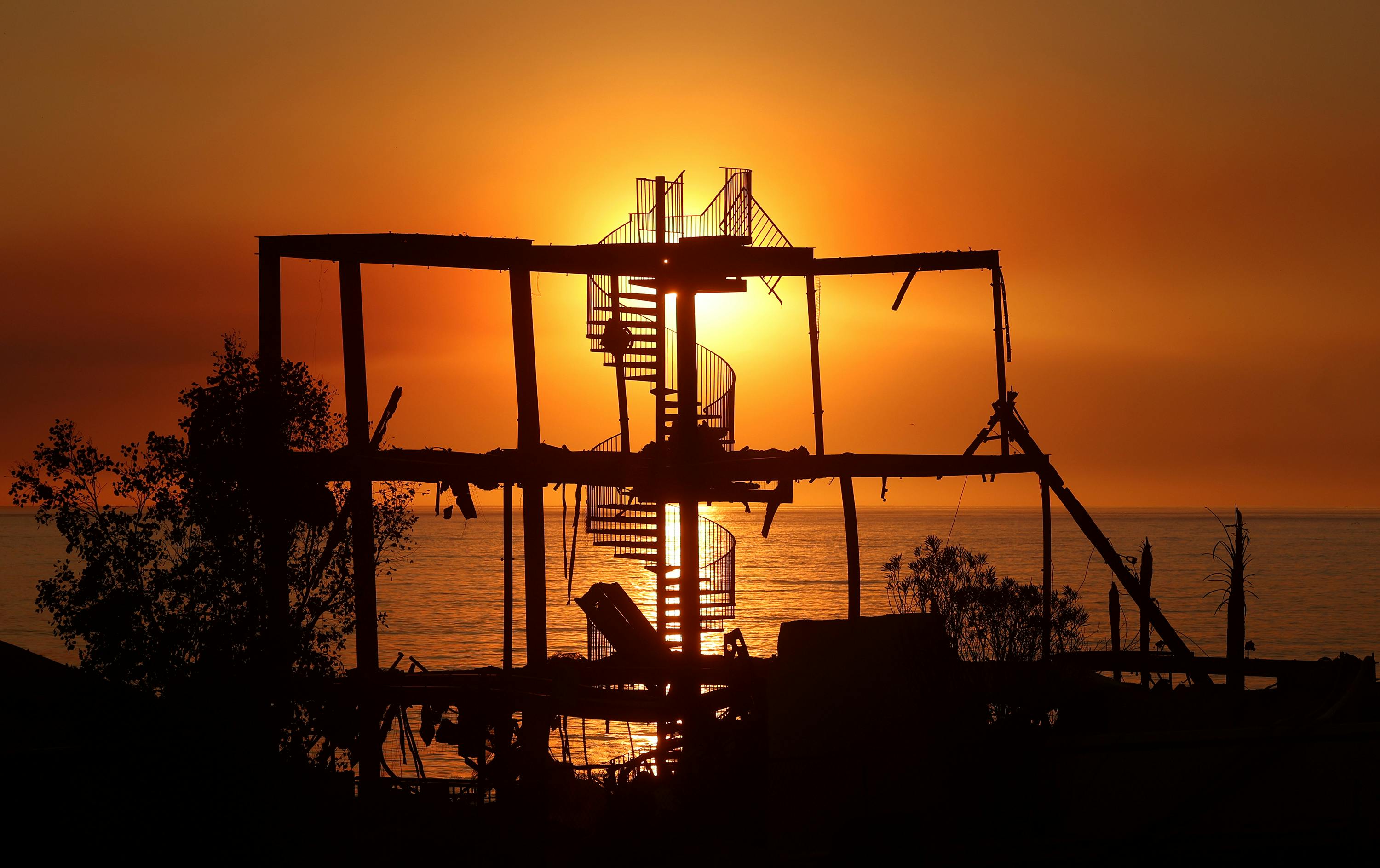 A stairway is all that remains after wildfires consumed hundreds of homes, including this one in Malibu, along the Pacific Coast Highway.