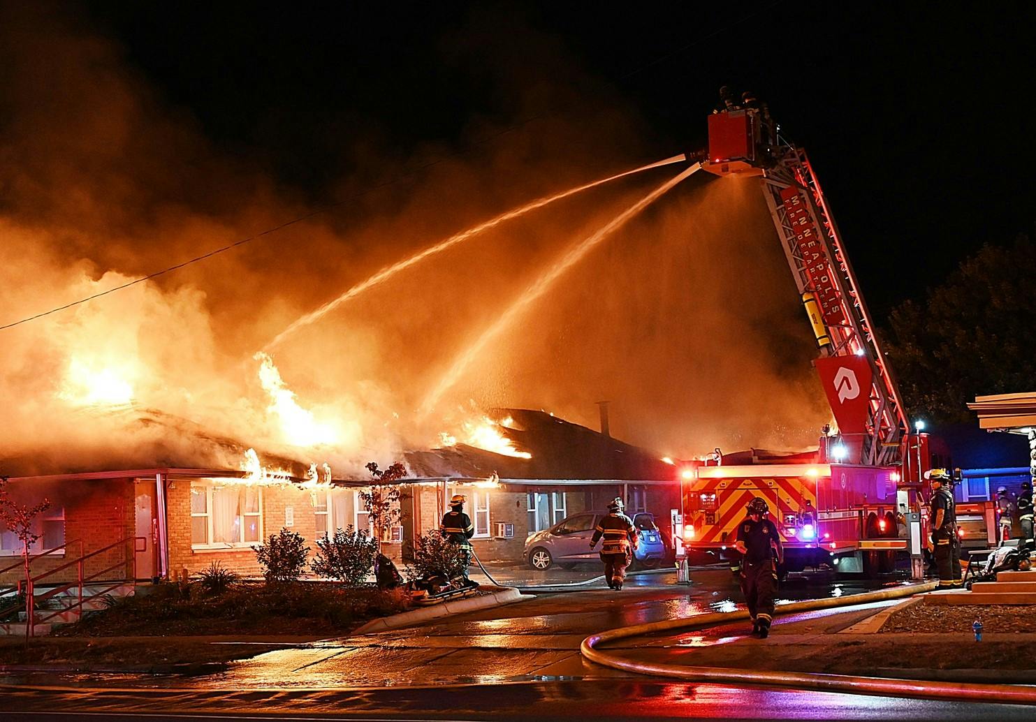 Minneapolis Fire Department Engine 27 reported a row of garages fully involved and requested a second alarm.