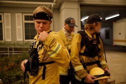 Volunteer firefighter for the Boulder Creek Fire District Jaden Keil-Ribera, 19, left, checks his radio as he waits in front of the fire station before he and other volunteer firefighters in 2020. Volunteer firefighter for the Boulder Creek Fire District Jaden Keil-Ribera, 19, left, checks his radio as he waits in front of the fire station before he and other volunteer firefighters in 2020.