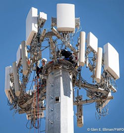 Firefighters set up their rescue system atop the 150-foot tower in Burleson. Firefighters set up their rescue system atop the 150-foot tower in Burleson.