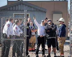 Fort Worth Battalion Chief David Knox (pointing) coordinates with rescuers as they put a rescue plan into action. Fort Worth Battalion Chief David Knox (pointing) coordinates with rescuers as they put a rescue plan into action.