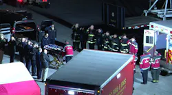 Firefighters Salute as Flag-draped Casket of Helicopter Crew Member