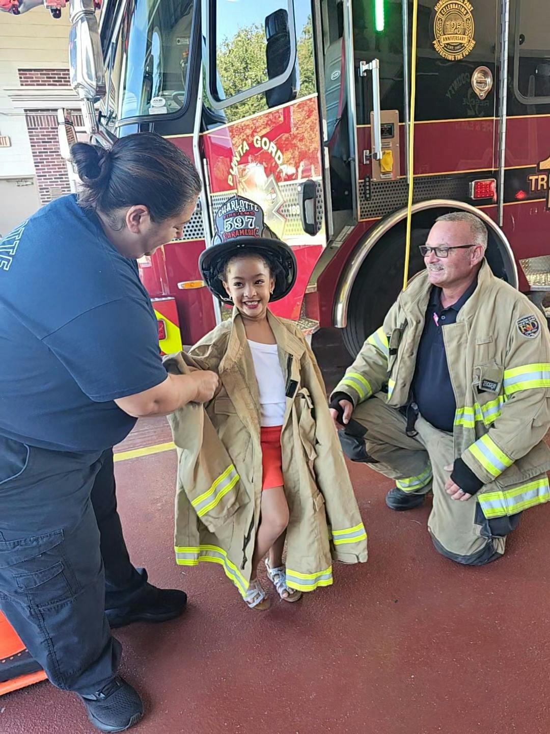 When 5-year-old Mila asked for a tour of the downtown firehouse of the Punta Gorda, FL, Fire Department, she was received enthusiastically. Rather than pawning off the assignment to a member with less seniority, 15-year veteran CW McLeod (right) jumped at the chance. Paramedic Daryn Favara (left) joined in eagerly.