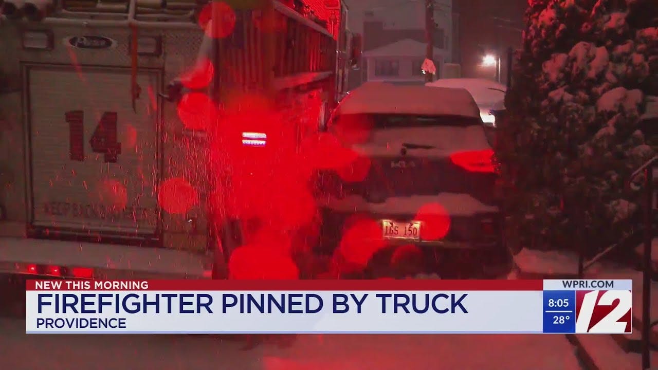 Firefighter pinned between vehicles