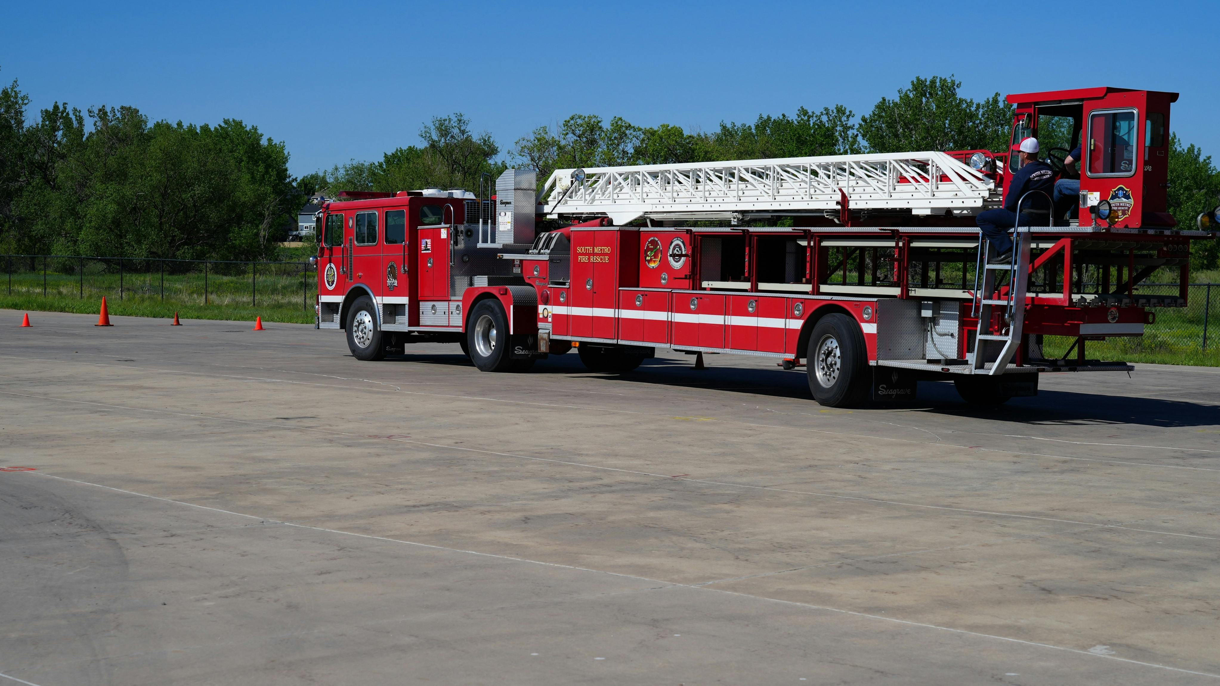 South Metro firefighters conduct driver training for engineers in the tractor driver and tiller positions with the used tractor-drawn apparatus.