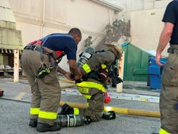 Eight firefighters (an interior chief officer, two drivers and the members of the rapid intervention team, or RIT, who are at the top of the stairs) operate at a commercial building fire. Not shown are an additional six firefighters who are operating on one 2½-inch interior attack line. Eight firefighters (an interior chief officer, two drivers and the members of the rapid intervention team, or RIT, who are at the top of the stairs) operate at a commercial building fire. Not shown are an additional six firefighters who are operating on one 2½-inch interior attack line.