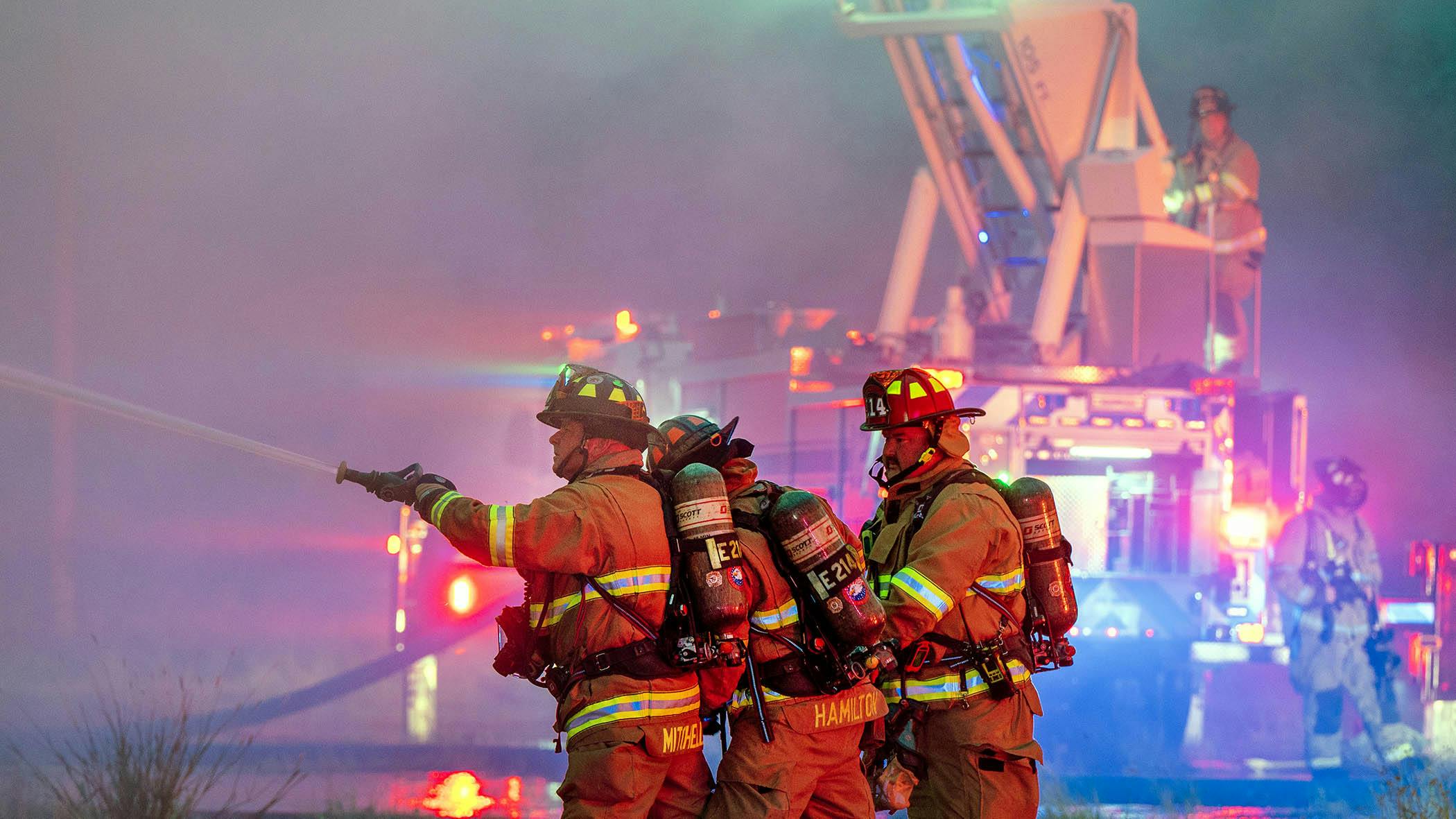 Among the many duties of an Incident Safety Officer at a scene, they must monitor structural instability and fire progression to ensure the safety of firefighters operating around the incident.