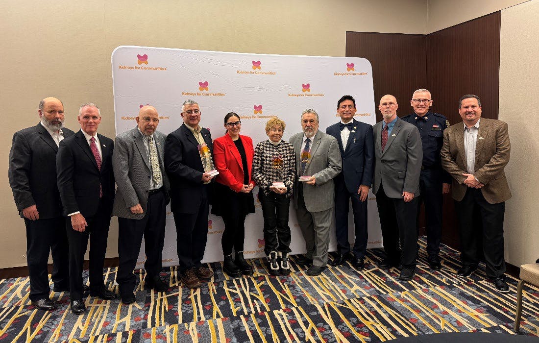 Award recipients and presenters gather for a group photo at the National Community Impact Award ceremony.