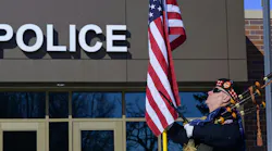 A bagpiper, who didn't identify himself, stood outside the Burnsville Police Department Tuesday, the first anniversary of the deaths of two officers and a firefighter/paramedic.