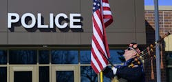 A bagpiper, who didn't identify himself, stood outside the Burnsville Police Department Tuesday, the first anniversary of the deaths of two officers and a firefighter/paramedic. A bagpiper, who didn't identify himself, stood outside the Burnsville Police Department Tuesday, the first anniversary of the deaths of two officers and a firefighter/paramedic.