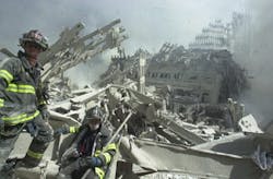 Firefighters search through rubble of the World Trade Center towers on Sept. 11. Firefighters search through rubble of the World Trade Center towers on Sept. 11.