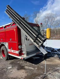 Once the Double Hard Sleeve Gantry is slid to the rear of the apparatus and then tilted upward at an approximate 45-degree angle, the hook and loop straps are released to access the sections of hard sleeve for deployment. Once the Double Hard Sleeve Gantry is slid to the rear of the apparatus and then tilted upward at an approximate 45-degree angle, the hook and loop straps are released to access the sections of hard sleeve for deployment.