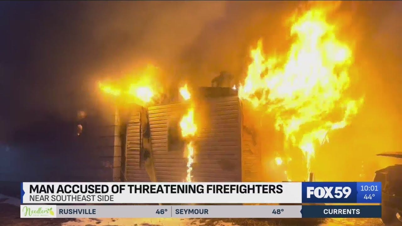 Man accused of threatening Indy firefighters during house fire