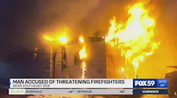 Man accused of threatening Indy firefighters during house fire