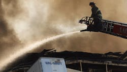 A firefighter battled a 2022 fire at a Walmart warehouse in Plainfield, IN. A firefighter battled a 2022 fire at a Walmart warehouse in Plainfield, IN.