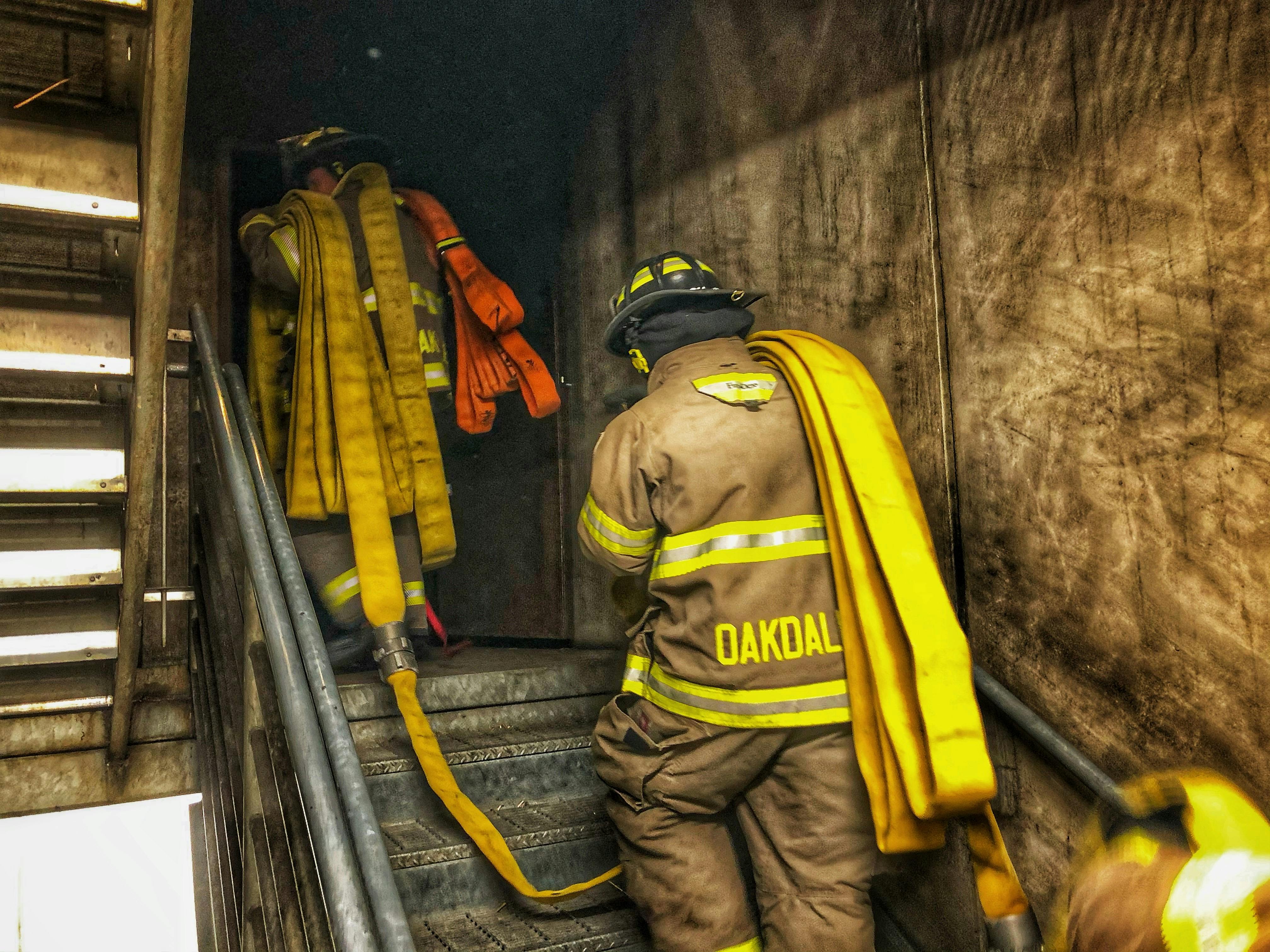 When stretching hose to upper floors, the required hose should be loaded onto the firefighters in a manner that allows it to pay off efficiently.