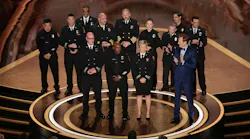 Firefighters from California join Oscars host Conan O'Brien on stage during a tribute to their valiant efforts for January's wildfires during Sunday night's 97th Academy Awards at the Dolby Theatre.