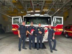 Lt. Josh Marzolf, Engineer/Paramedic Michael Juachon, Lt. Jeremey Saunders and Engineer Austin Colburn pictured with a donated pet oxygen mask and therapy dog Winston. Lt. Josh Marzolf, Engineer/Paramedic Michael Juachon, Lt. Jeremey Saunders and Engineer Austin Colburn pictured with a donated pet oxygen mask and therapy dog Winston.
