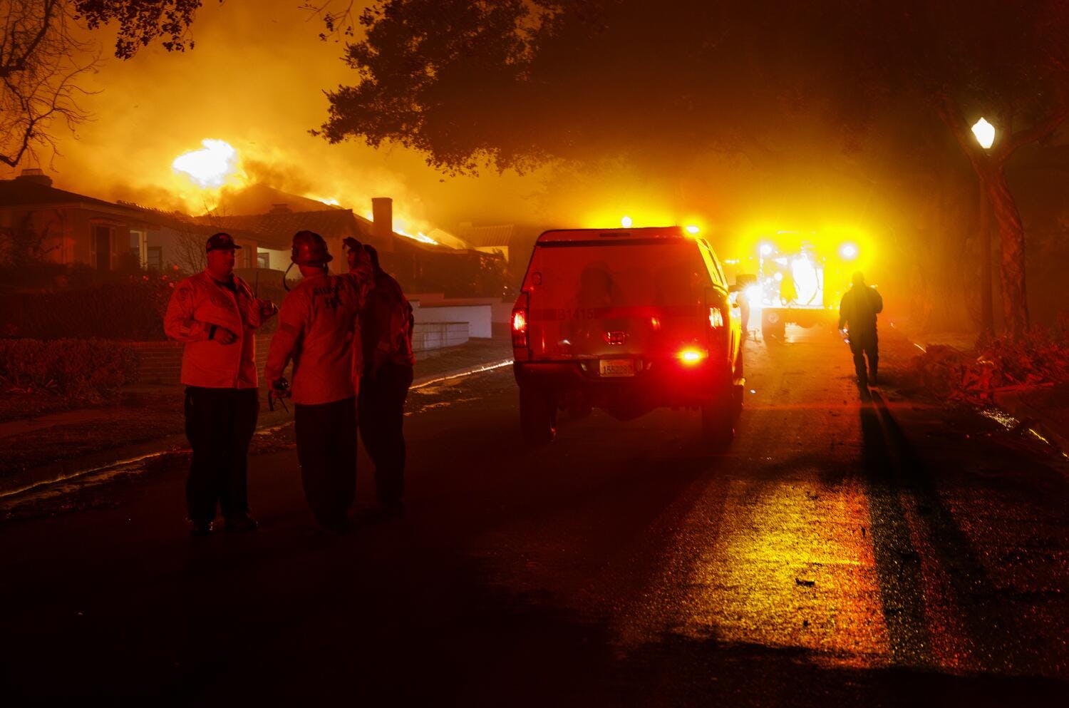 Glendale firefighters assess their strategy as the wind whipped Eaton fire destroys homes on Jan. 7.