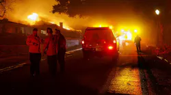 Glendale firefighters assess their strategy as the wind whipped Eaton fire destroys homes on Jan. 7.
