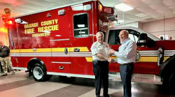 President of the REV Ambulance Division, Mark Van Arnam, hands over the keys to Orange County Fire Chief James Fitzgerald for their latest delivery. Orange County Fire Rescue Department has been a Wheeled Coach customer since 1979.