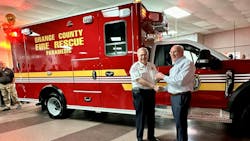 President of the REV Ambulance Division, Mark Van Arnam, hands over the keys to Orange County Fire Chief James Fitzgerald for their latest delivery. Orange County Fire Rescue Department has been a Wheeled Coach customer since 1979. President of the REV Ambulance Division, Mark Van Arnam, hands over the keys to Orange County Fire Chief James Fitzgerald for their latest delivery. Orange County Fire Rescue Department has been a Wheeled Coach customer since 1979.
