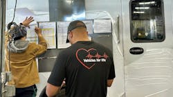 REV Group, owner of Wheeled Coach, uses the slogan 'Vehicles for Life' because of their wide emergency vehicle portfolio. Here, workers check the process on the product production line for a new ambulance REV Group, owner of Wheeled Coach, uses the slogan 'Vehicles for Life' because of their wide emergency vehicle portfolio. Here, workers check the process on the product production line for a new ambulance