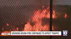 Growing brush fire continues to affect traffic
