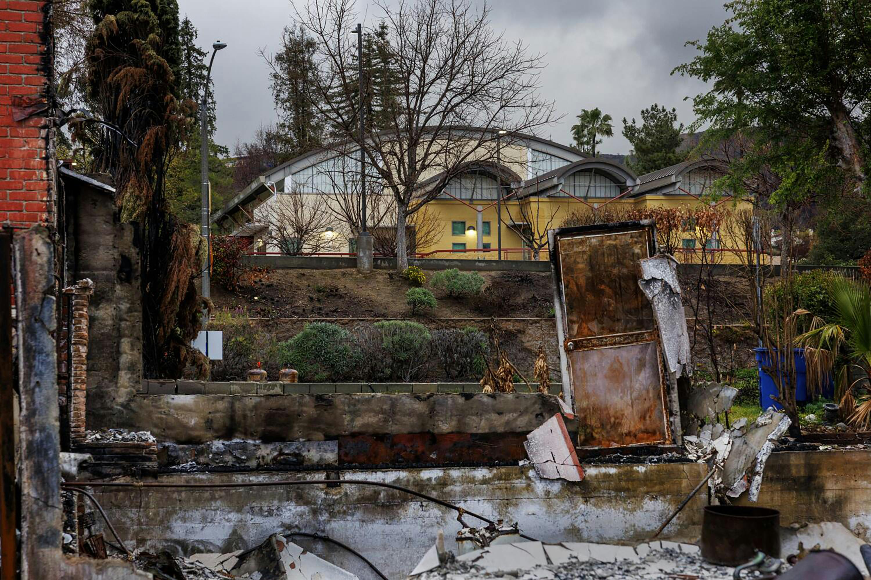 The cleanup of building debris in Altadena continues two months after the historic wildfires.