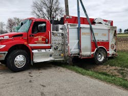 A heavy wrecker lifted the Switz City Fire Department after it rolled over. A heavy wrecker lifted the Switz City Fire Department after it rolled over.