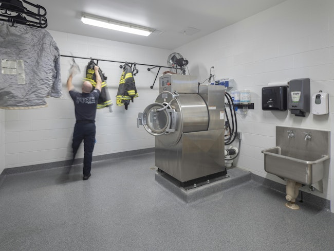 South Metropolitan Fire Protection District’s Station 42 in Lake Winnebago, MO, includes Warm Zone areas that have ample room for washing and storing gear. Gear is hung to dry, with a circulating fan and HVAC equipment to aid in the drying, to produce a near Cold Zone.