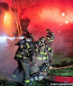Fort Worth firefighters pull an injured firefighter from the collapse debris. Fort Worth firefighters pull an injured firefighter from the collapse debris.
