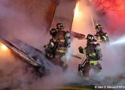 A group of Fort Worth firefighters work to free another firefighter trapped by Saturday morning's collapse. A group of Fort Worth firefighters work to free another firefighter trapped by Saturday morning's collapse.
