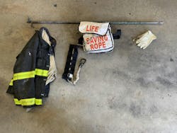 Some of the equipment that’s needed to conduct a roof rope training: PPE, a hook (in this case, used as an anchor), roof rope bag and gloves. Some of the equipment that’s needed to conduct a roof rope training: PPE, a hook (in this case, used as an anchor), roof rope bag and gloves.