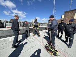 Members setting up the traditional method of deploying the ARS roof rope kit. Members setting up the traditional method of deploying the ARS roof rope kit.