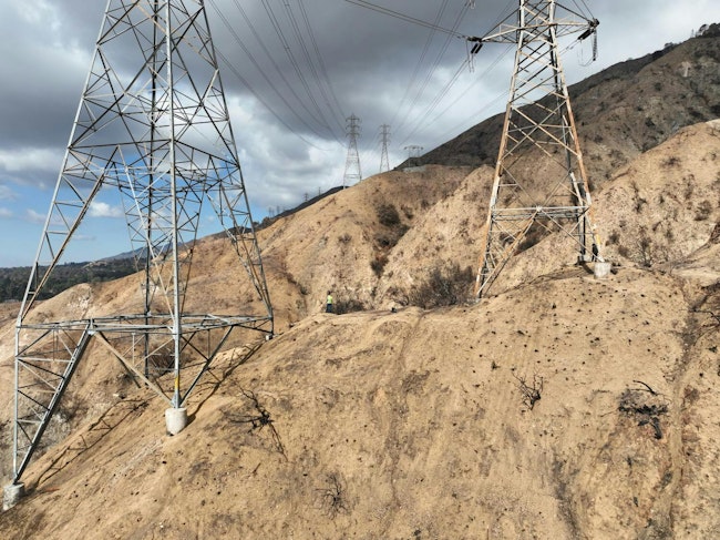 The focus has shifted to an idle transmission tower.