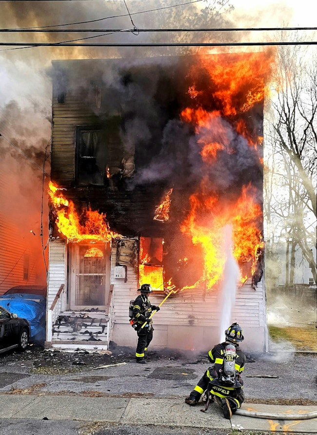 Members of the Albany, NY, Fire Department responded for a reported structure fire with occupants jumping from the structure. First-arriving units found a vacant building well involved, with fire rapidly extending into the B-side exposure. A second alarm was transmitted. Multiple lines were deployed, and a search of the original fire building was initiated. Companies contended with high winds, bitterly cold temperatures and burning overhead live electrical wires. Approximately 50 firefighters and 13 apparatus were on scene. A squatter who jumped from the vacant building wasn’t located.