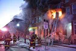 The Baltimore City Fire Department arrived to find heavy fire showing from the first floor of a middle-of-the-group, vacant dwelling. Battalion Chief 3 arrived, reported heavy fire on the first and second floors and ordered an exterior operation. Engine 8 reported three stories in the rear, concrete blocks covering the windows, heavy fire showing and a 2-inch hoseline being deployed. Command made it a working fire, which brought, among others, Truck 10 for ladder pipe operations in the rear. The fire extended to attached vacant exposures. Command requested the second alarm. Tower 1 set up for tower ladder operations. The Baltimore City Fire Department arrived to find heavy fire showing from the first floor of a middle-of-the-group, vacant dwelling. Battalion Chief 3 arrived, reported heavy fire on the first and second floors and ordered an exterior operation. Engine 8 reported three stories in the rear, concrete blocks covering the windows, heavy fire showing and a 2-inch hoseline being deployed. Command made it a working fire, which brought, among others, Truck 10 for ladder pipe operations in the rear. The fire extended to attached vacant exposures. Command requested the second alarm. Tower 1 set up for tower ladder operations.